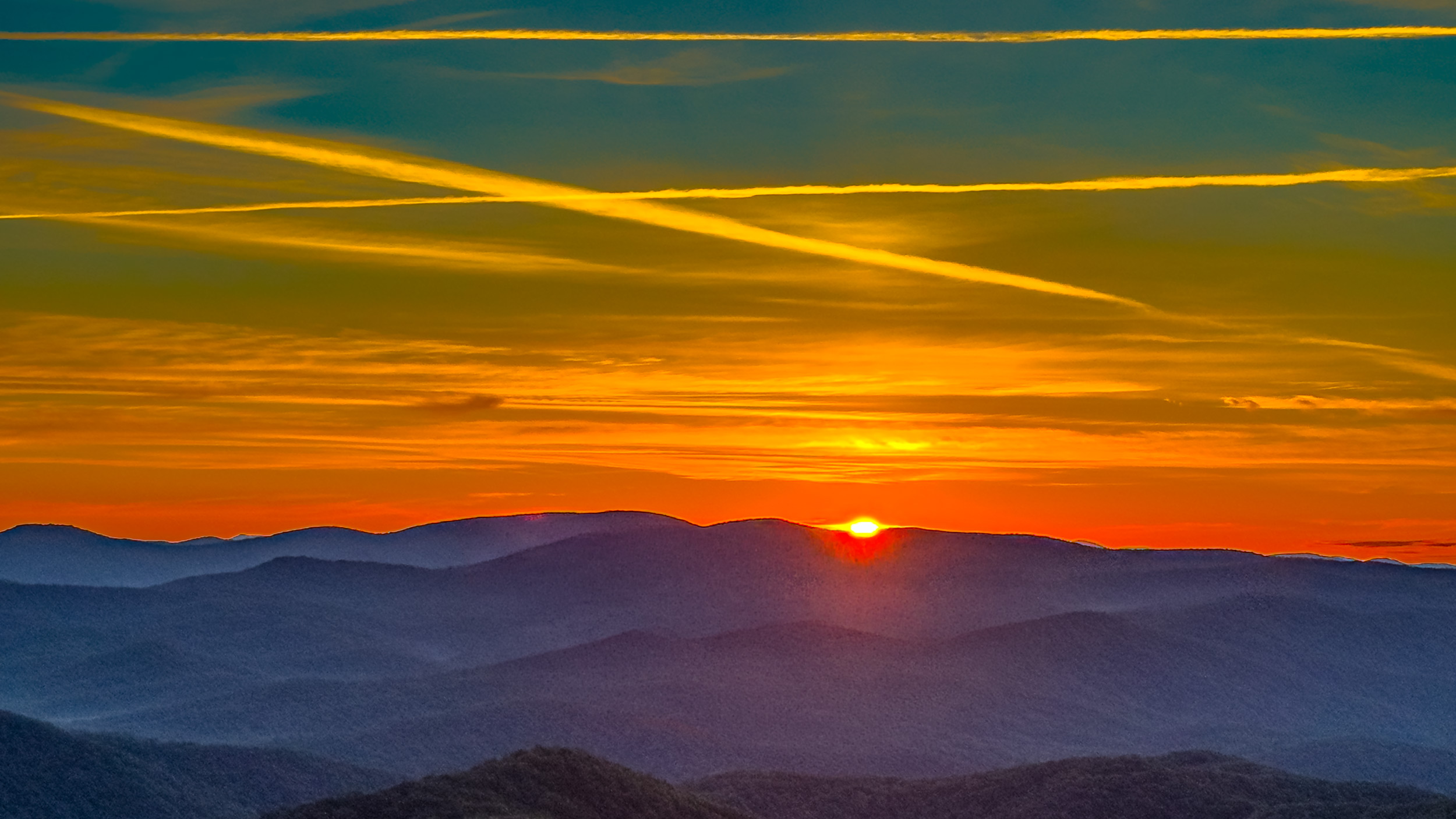 015 2026 06 24 golden sunrise and sky trails over blue ridge