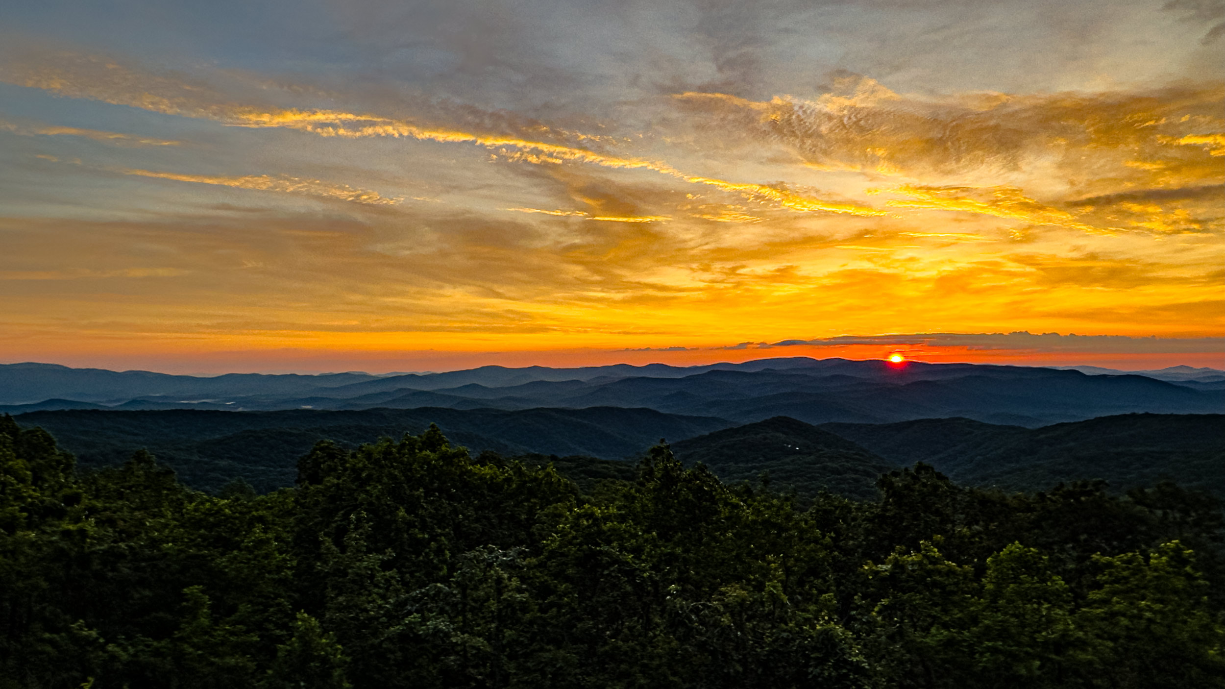 030 2026 05 29 golden clouds over summer blue ridge